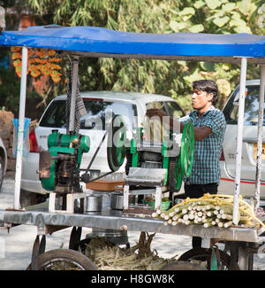 Benaulim, Goa, India. Saturday 12th November 2016. Street vendor makes fresh sugar cane juice during festival in Goa, India. Credit:  WansfordPhoto/Alamy Live News Stock Photo