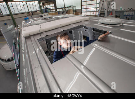 Bozo Marelja, an engineer at the car company Carl Friedrichs Ltd., inside a Mercedes SUV being retrofitted with bullet-proof armouring in Frankfurt am Main, Germany, 13 October 2016. Founded in 1840, the specialist car company today employs 115 workers. Many of the cars constructed by the firm are armoured escort vehicles that are exported across the world. Photo: Frank Rumpenhorst/dpa Stock Photo