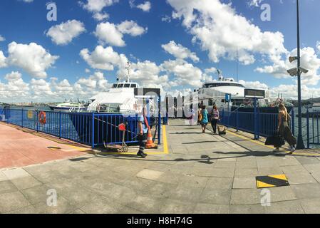 Fast ferry boat at the Kadikoy port. Boats travelling between the European and Asian ports of Istanbul. Commercial name of boat company is IDO. Stock Photo