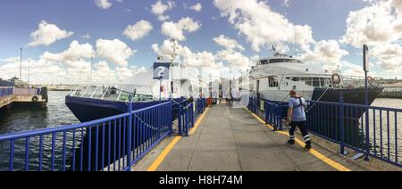 Fast ferry boat at the Kadikoy port. Boats travelling between the European and Asian ports of Istanbul. Commercial name of boat company is IDO. Stock Photo