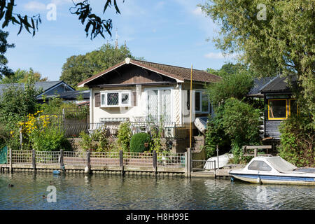 Riverside house on Tagg's Island, River Thames, Hurst Park, West Molesey, Surrey, England, United Kingdom Stock Photo