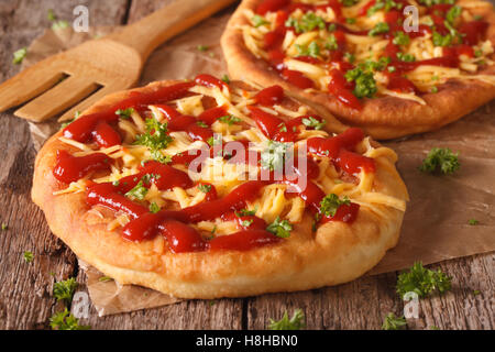 Hungarian Food: langos with cheese and ketchup on the table close-up. horizontal Stock Photo