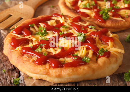 Hungarian deep fried fast food langos with cheese and ketchup on the table close-up. horizontal Stock Photo