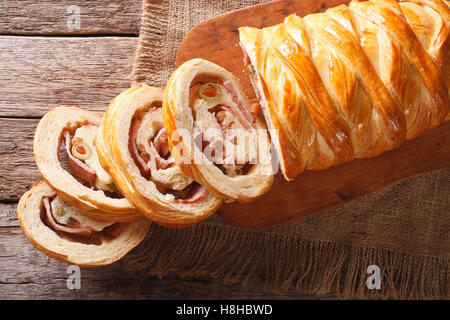 Venezuelan tasty bread pan de jamon close-up on the table. Horizontal view from above Stock Photo
