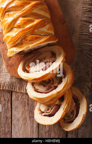 Venezuelan tasty bread pan de jamon close-up on the table. Vertical view from above Stock Photo