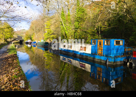 Barges moored along the Rochdale Canal in autumn, near Hebden Bridge West Yorkshire England UK Stock Photo