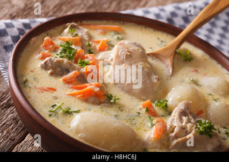 Tasty Belgian waterzooi soup with chicken macro in a bowl on the table. horizontal Stock Photo