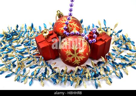 Two Christmas balls with two gifts and a garland Stock Photo