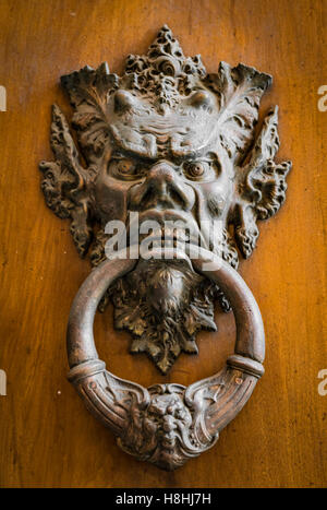 Vintage brass door knob on the wooden background Stock Photo