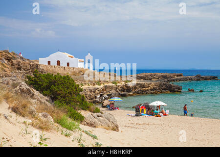 Zakynthos, Greece - August 18, 2016: Coastal landscape of Agios Nikolaos beach. White Orthodox church on the Ionic Sea coast Stock Photo