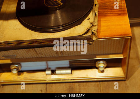 Old wooden radio with vinyl records Stock Photo