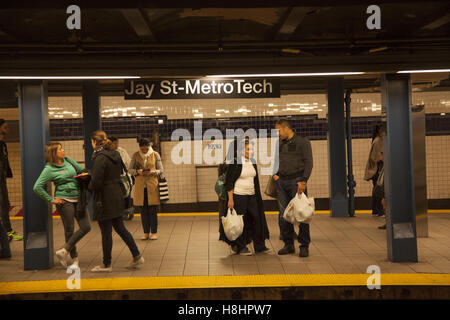 People wait for trains at the Jay Street MetroTech subway station in