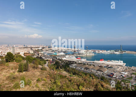 Spain, Barcelona, view over the city and port from Montjuic Hill, seaside cityscape