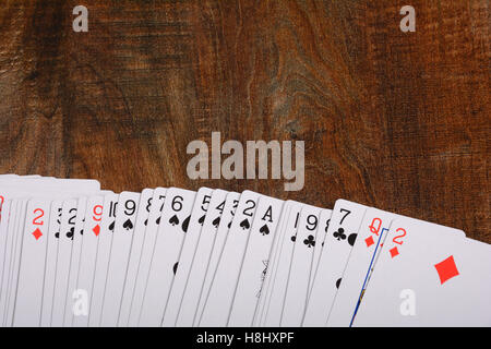 Playing cards on wooden table Banner. Stock Photo