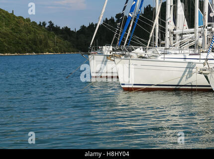 Nidri, GREECE, May 11, 2013: The white yachts in blue harbour in Ionian sea, Greece. Stock Photo