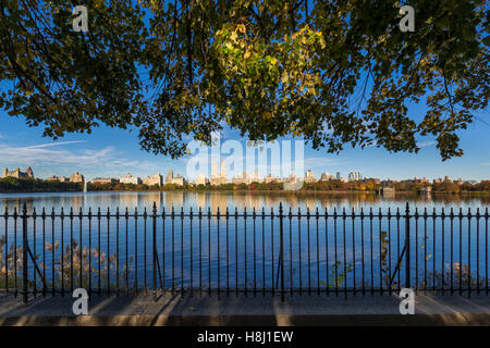 Fall in Central Park with view on the Upper West Side from the Jacqueline Kennedy Onassis Reservoir. New York City Stock Photo