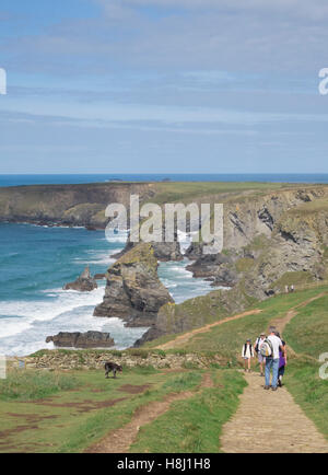 Walkers on the South West Coast Path at the Bedruthan Steps, North Cornwall, England, UK Stock Photo