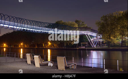 Germany, Oberhausen, illuminated pedestrian bridge Slinky Springs to Fame also named Rehberger bridge across Rhein-Herne canal Stock Photo