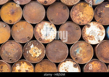 Brown background of old rusty oil barrels Stock Photo