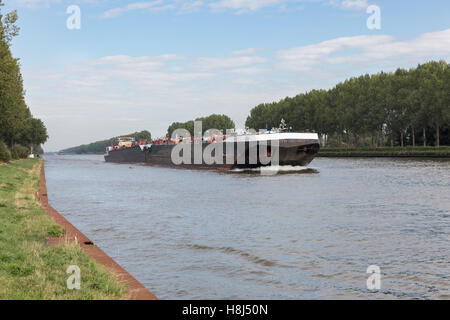 Big barge navigating at Dutch canal near Amsterdam Stock Photo