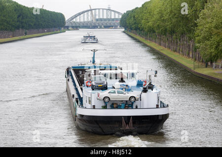 Big barge navigating at Dutch canal near Amsterdam Stock Photo