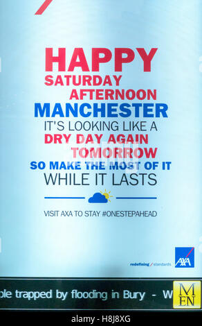 Information sign in Manchester quoting dry day again with 'flooding in Bury' along the bottom Stock Photo