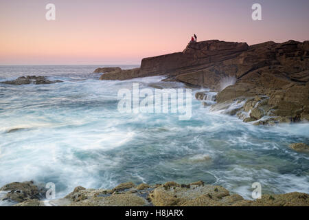 Water flowing against the shore - sunset at Ile Grande, Brittany Stock Photo