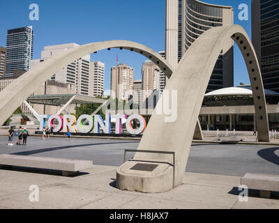 Nathan Phillips Square a major tourist attraction, is an urban plaza in Toronto, Canada. It forms the forecourt to Toronto City Hall Stock Photo