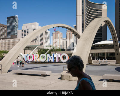 Nathan Phillips Square a major tourist attraction, is an urban plaza in Toronto, Canada. It forms the forecourt to Toronto City Hall Stock Photo