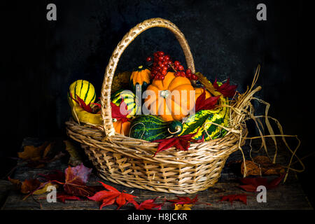 A selection of autumn vegetables in a basket - in vintage style Stock Photo