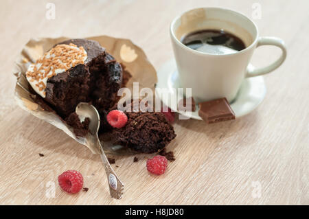 Morning aromatic coffee with a muffin raspberries and chocolate for Breakfast. Stock Photo