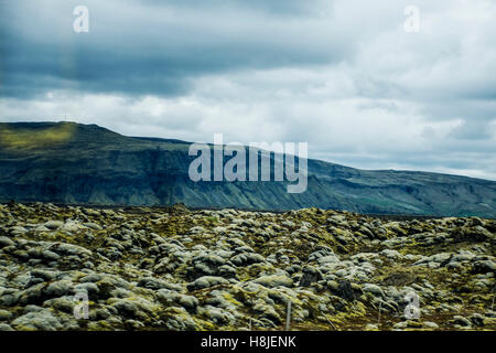 Epic surreal Landscape in Iceland with green grass and rocks Stock Photo