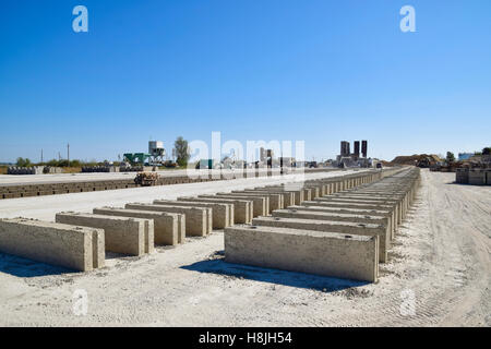 Cinder blocks lie on the ground and dried. on cinder block production plant Stock Photo