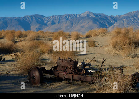 Abandoned Mining Equipment In The Owens Valley With The Sierra Nevada Mountain Range Behind. Stock Photo