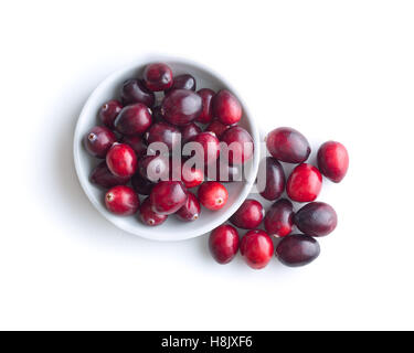 The tasty american cranberries in bowl isolated on white background. Top view. Stock Photo