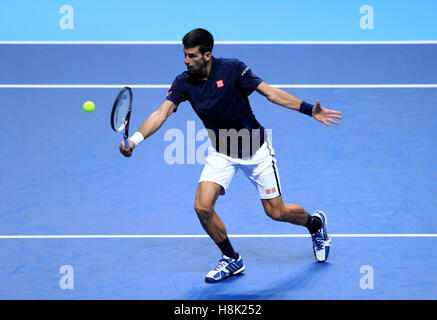 Serbia's Novak Djokovic in action against Austria's Dominic Thiem during day one of the Barclays ATP World Tour Finals at The O2, London. PRESS ASSOCIATION Photo. Picture date: Sunday November 13, 2016. See PA story TENNIS London. Photo credit should read: Adam Davy/PA Wire. Stock Photo
