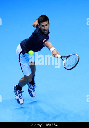Serbia's Novak Djokovic in action against Austria's Dominic Thiem during day one of the Barclays ATP World Tour Finals at The O2, London. PRESS ASSOCIATION Photo. Picture date: Sunday November 13, 2016. See PA story TENNIS London. Photo credit should read: Adam Davy/PA Wire. Stock Photo