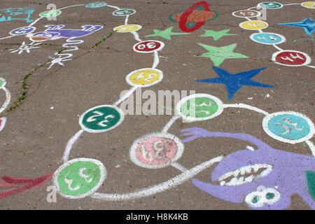 childish drawings of game on the asphalt of street Stock Photo