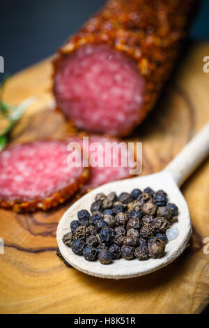 Delicious smoked salami sausage with salt, spices and herbs cut into ...