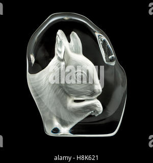 Glass squirrel ornament against black background Stock Photo
