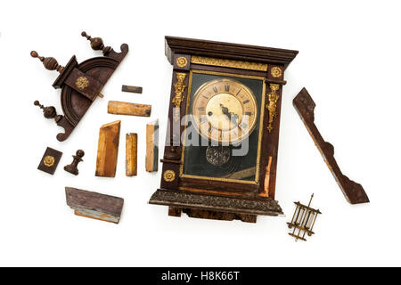 Broken antique clock ready for restoration by a horologist Stock Photo