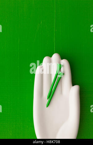 Detail of artifical hand with golf equipments  - Flat Lay Photography Stock Photo