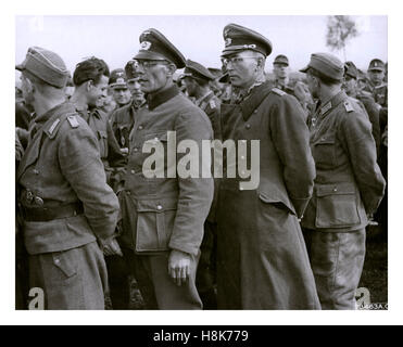WW2 German prisoners of war, Wehrmacht and enlisted men in uniform standing grouped together Stock Photo