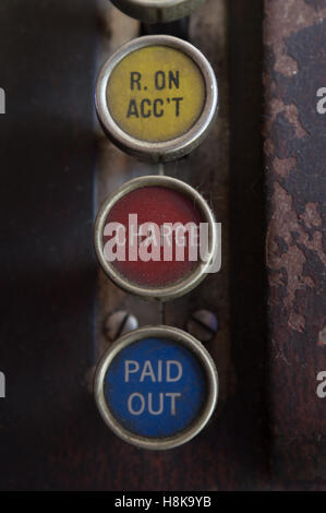 Close up of antique wooden cash register with three keys label R. ON ACC'T (received on account), charge and paid out. Stock Photo
