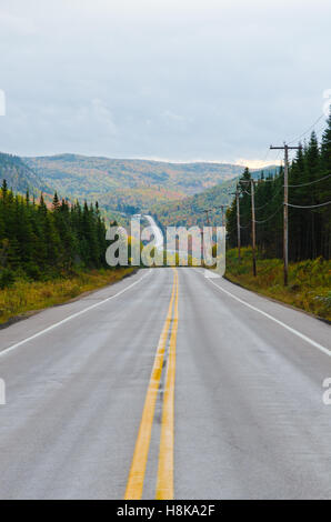 Autumn endless road under cloudscape, Quebec, Canada Stock Photo - Alamy