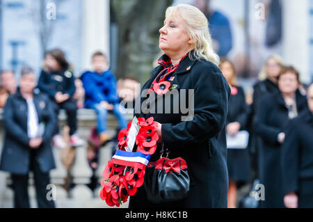 Belfast, Northern, Ireland. 13th Nov, 2016. The Hon Consul for France, Madame R McCollough lays a poppy wreath at the Remembrance Sunday service at Belfast City Hall Cenotaph. Credit:  Stephen Barnes/Alamy Live News Stock Photo