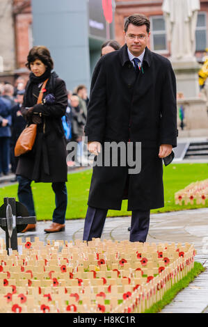 Belfast, Northern, Ireland. 13th Nov, 2016. Secretary of State for Northern Ireland, James Brokenshire MP looks at the wooden crosses before the Remembrance Sunday service at Belfast City Hall Cenotaph. Credit:  Stephen Barnes/Alamy Live News Stock Photo
