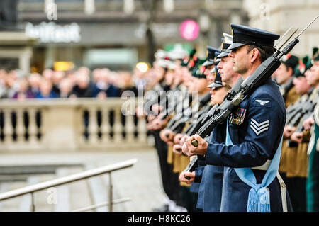 Belfast, Northern, Ireland. 13th Nov, 2016. Soldiers from the Royal Irish Regiment shoulder their weapons at the Remembrance Sunday service at Belfast City Hall Cenotaph. Credit:  Stephen Barnes/Alamy Live News Stock Photo