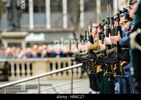 Belfast, Northern, Ireland. 13th Nov, 2016. Soldiers from the Royal Irish Regiment present arms at the Remembrance Sunday service at Belfast City Hall Cenotaph. Credit:  Stephen Barnes/Alamy Live News Stock Photo