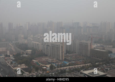 November 14, 2016 - Xi'An, Xi'an, China - Xi'an, CHINA-November 14 2016: (EDITORIAL USE ONLY. CHINA OUT).Heavy haze haunts Xi'an, capital of northwest China's Shaanxi Province, November 14th, 2016. The Xi'an Municipal Meteorological Center released a yellow alert of smoggy weather on November 13th, 2016, showing that air pollution hit Xi'an in winter again. Credit:  SIPA Asia/ZUMA Wire/Alamy Live News Stock Photo